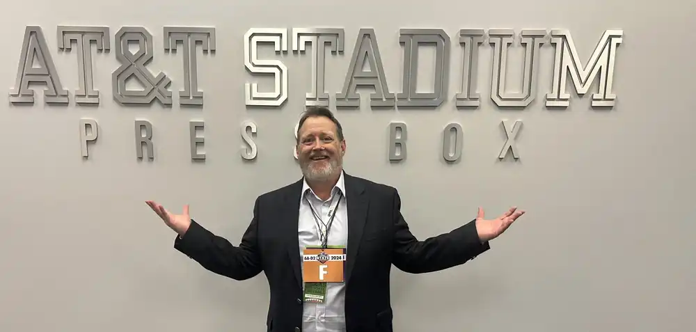 Chris Doelle working the press box at AT and T Stadium during the Texas high school football state championships
