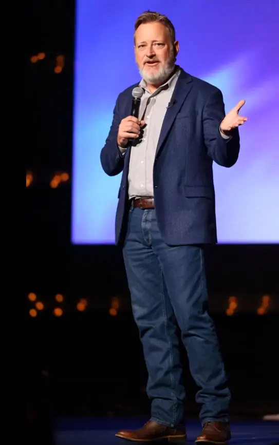 Chris Doelle speaking on stage